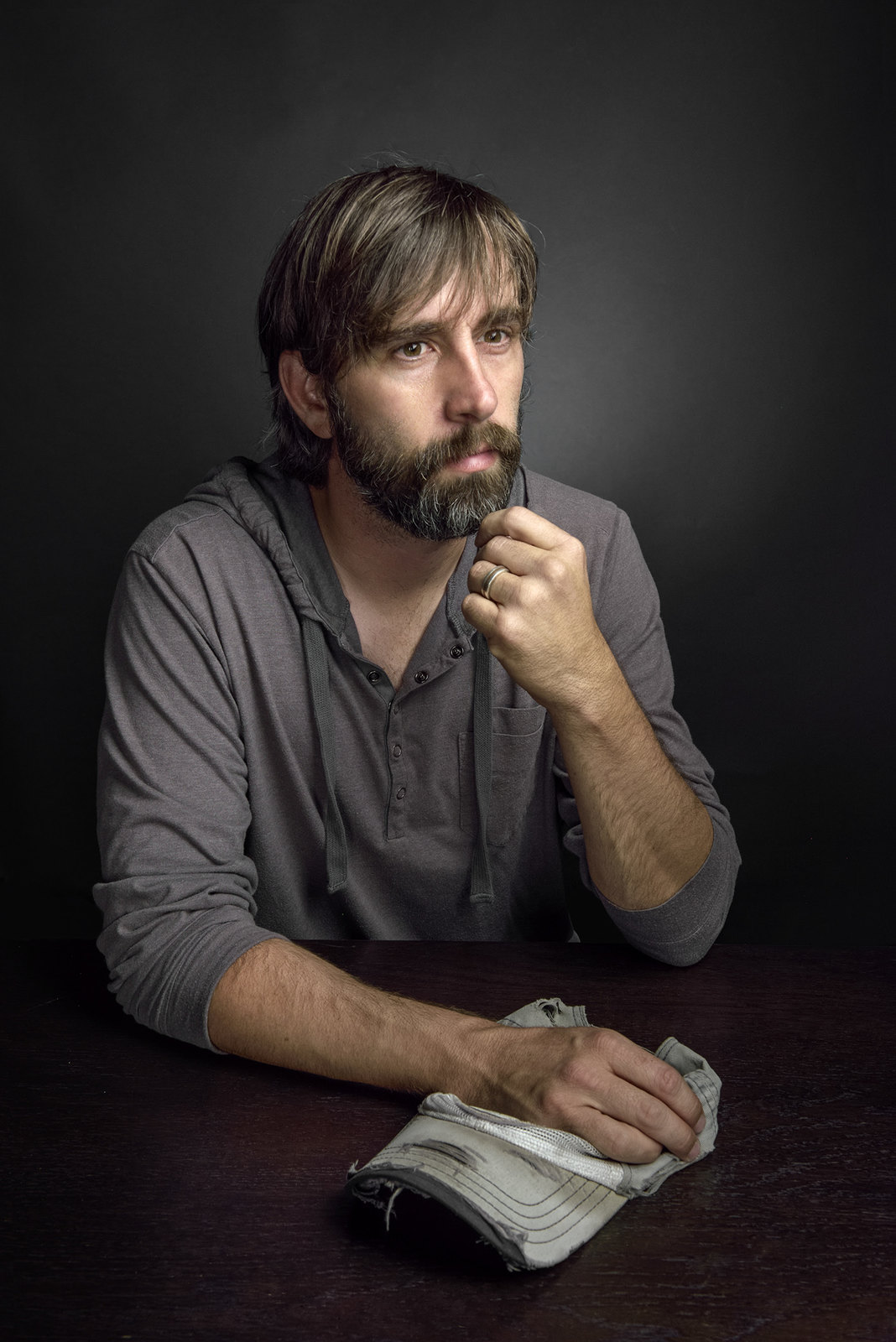 a man with a beard sitting at a table