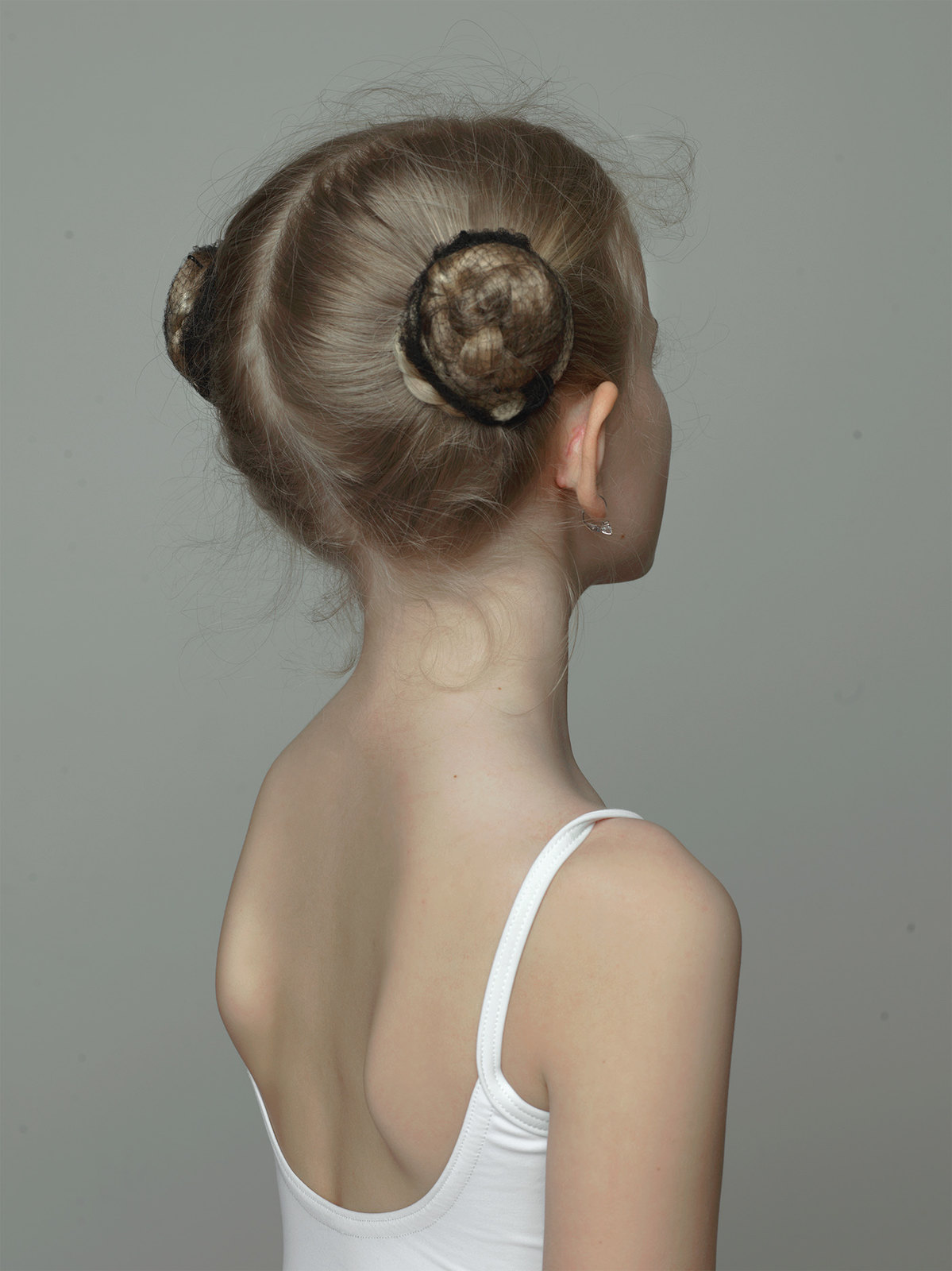 a woman with a bun in her hair