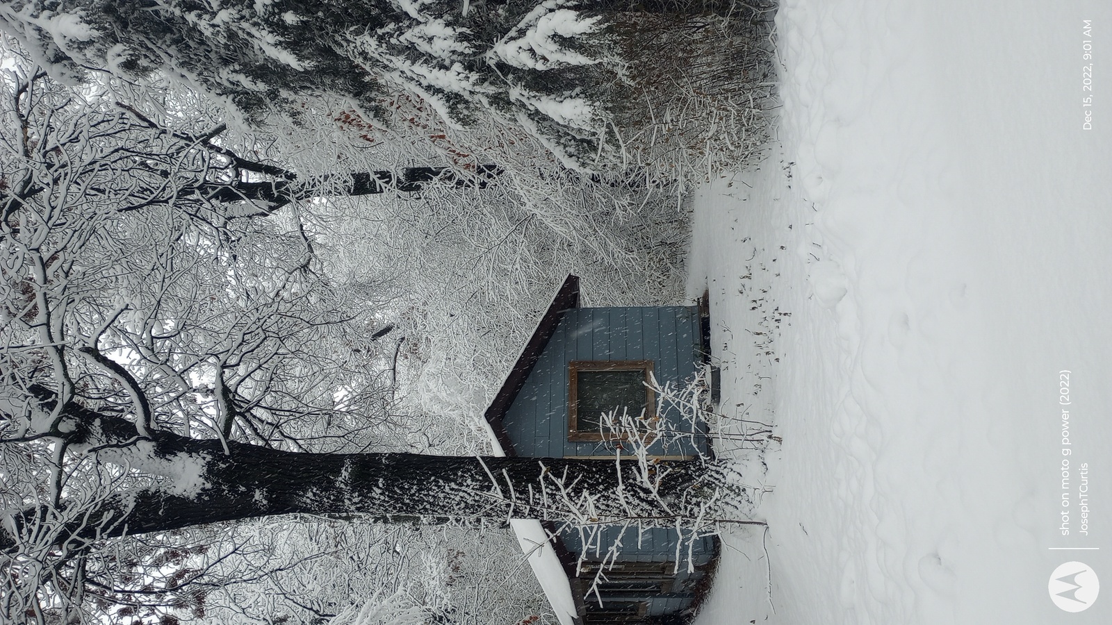 an aerial view of a house in the snow