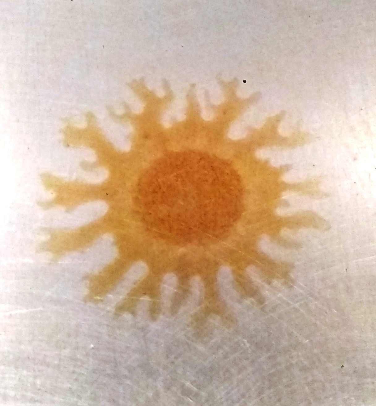 a picture of a yellow sun on a white background