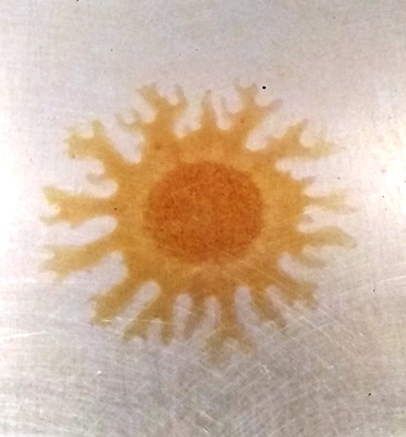 a picture of a yellow sun on a white background