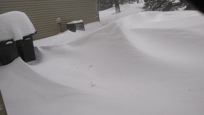 a pile of snow next to a house