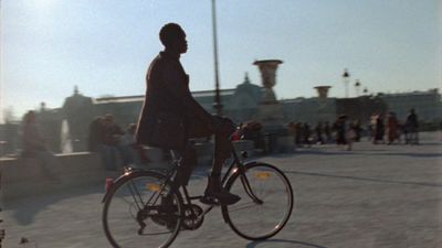 a man riding a bike down a street