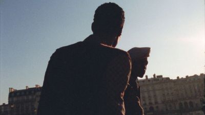 a silhouette of a man holding a cell phone