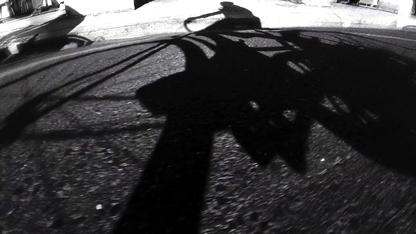 a person riding a skateboard on a city street