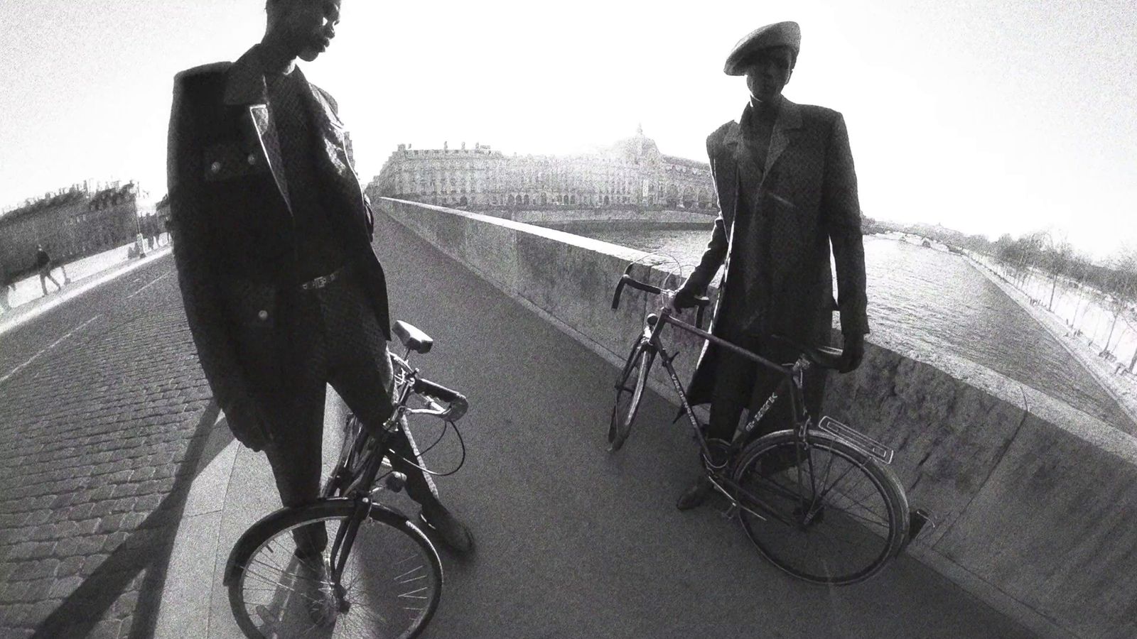 a man riding a bike next to a woman on a bike