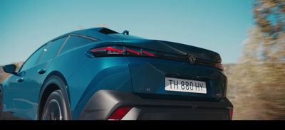 the rear end of a blue sports car