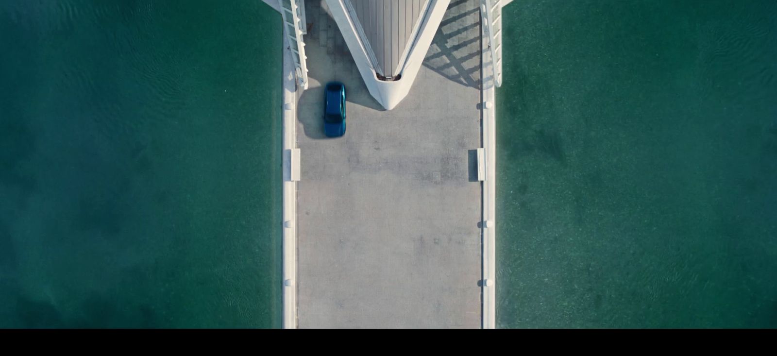 an aerial view of a boat docked at a pier