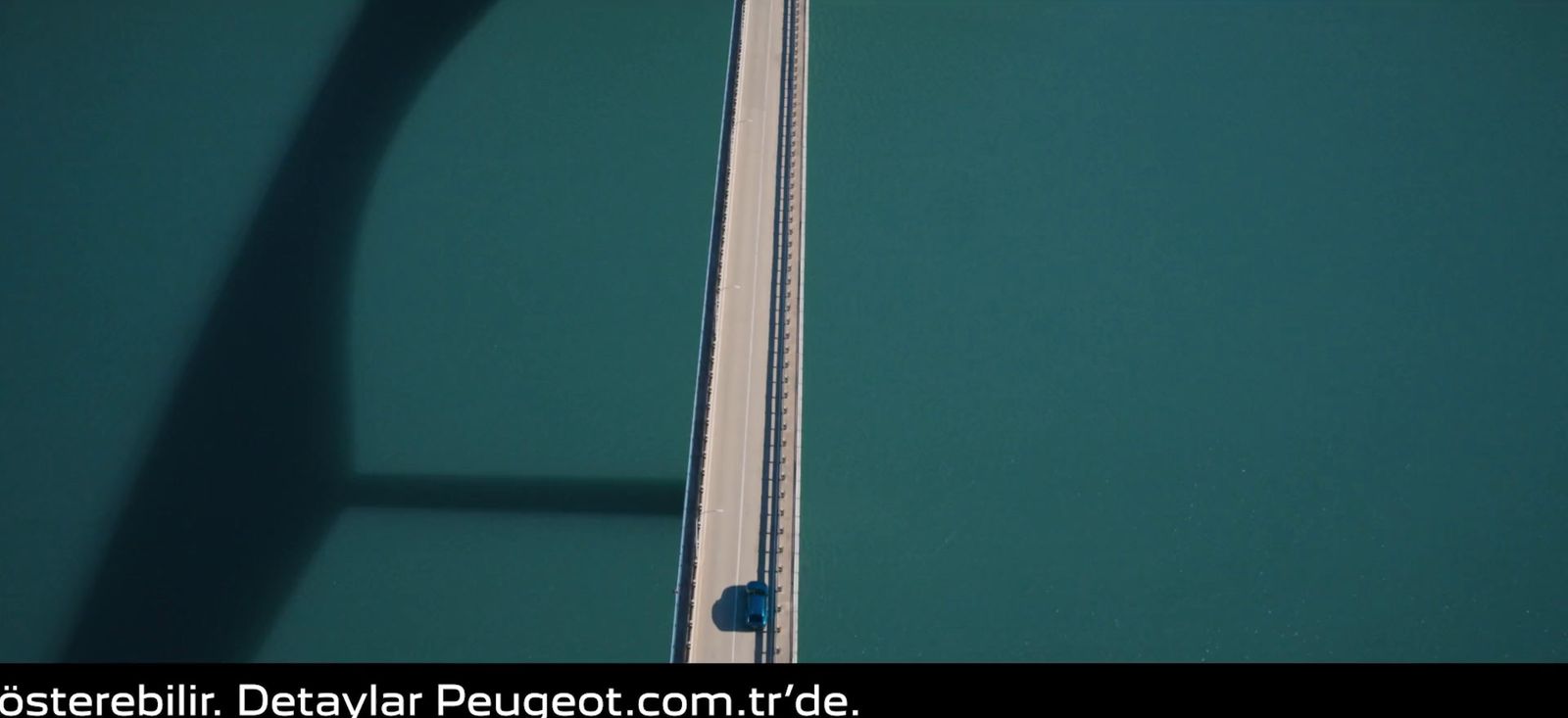 an aerial view of a tennis court with a tennis racket in the foreground