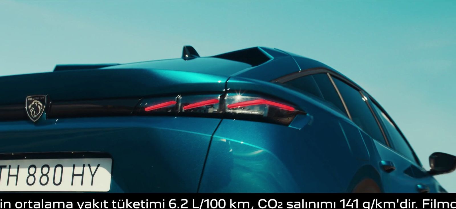 the tail lights of a blue sports car