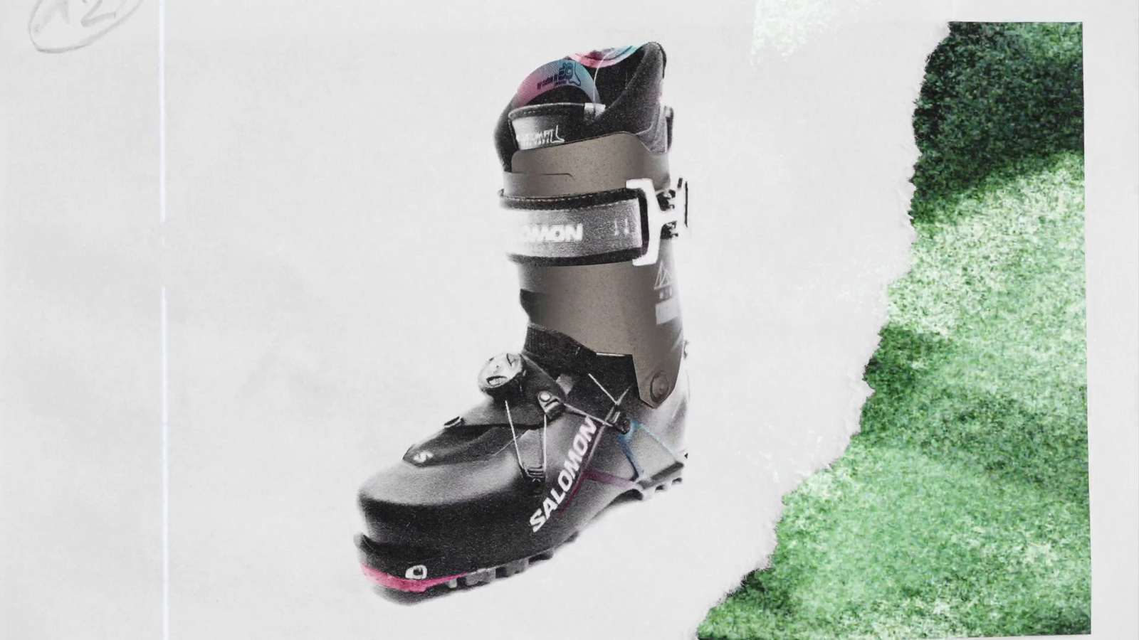 a pair of ski boots sitting on top of a snow covered ground