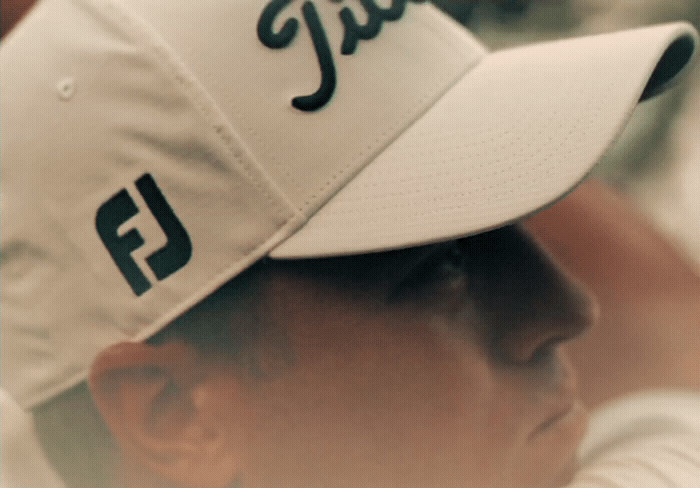 a close up of a baseball player wearing a hat