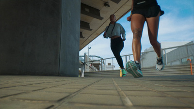 a couple of people that are walking down some steps