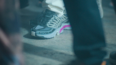 a close up of a person's shoes on the ground