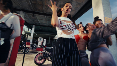 a group of women standing around each other