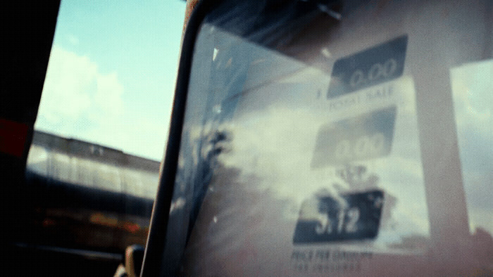 a close up of a bus window with a sky background