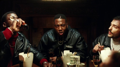 a group of men sitting at a table with drinks