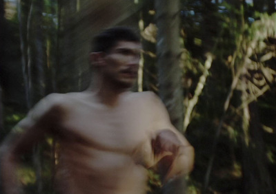 a blurry image of a man holding a frisbee