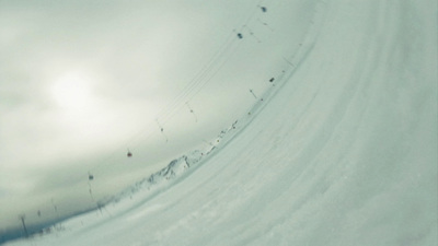 a person riding skis down a snow covered slope