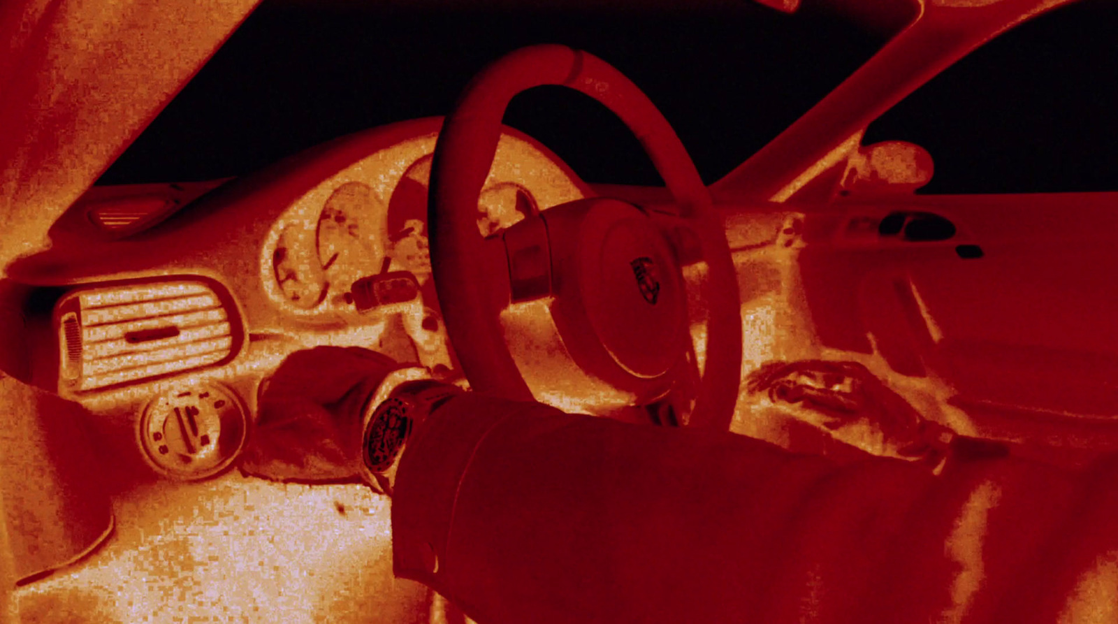 the interior of a car with a red filter