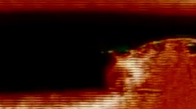 a blurry image of a man's face in the dark