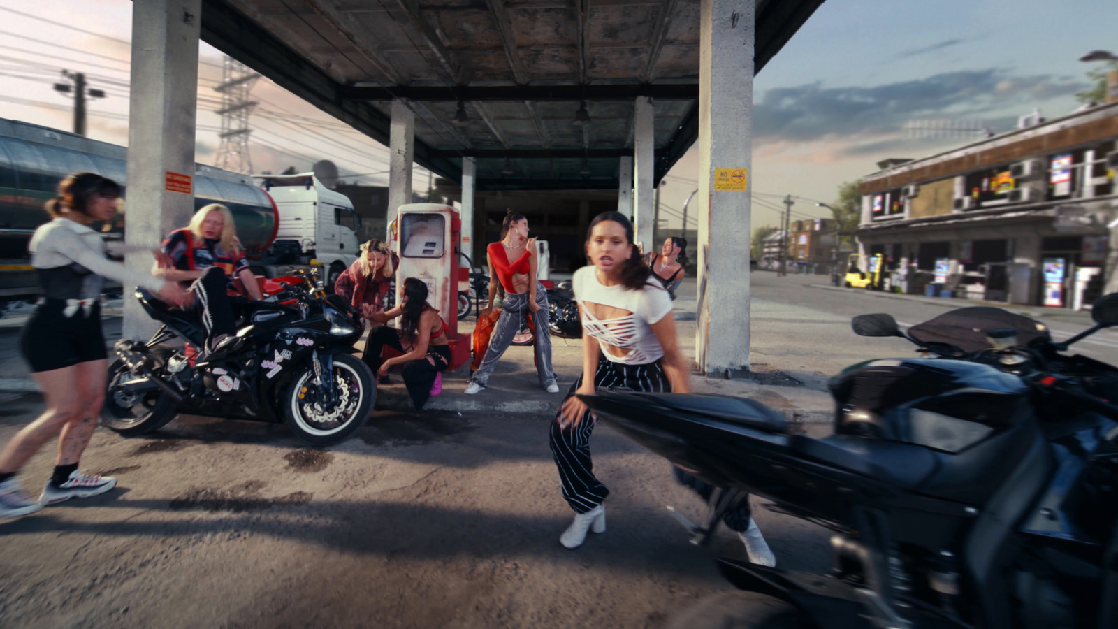 a group of people standing around a motorcycle