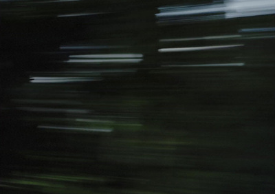 a blurry photo of a person holding a snowboard