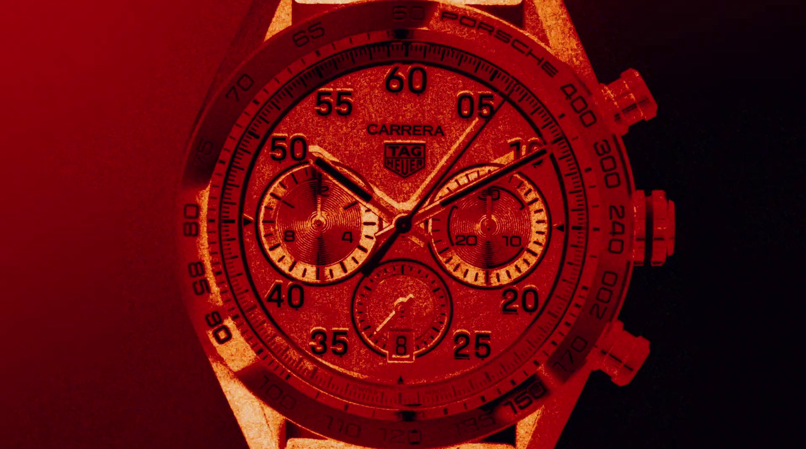 a close up of a watch on a red background