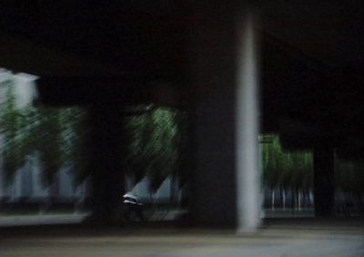 a blurry photo of a person holding an umbrella