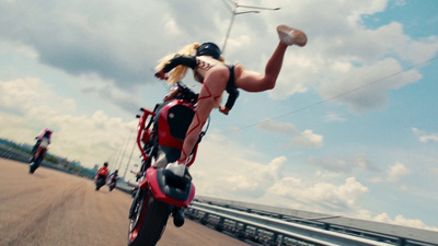 a person riding a motorcycle on a road