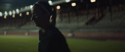 a blurry photo of a person on a soccer field