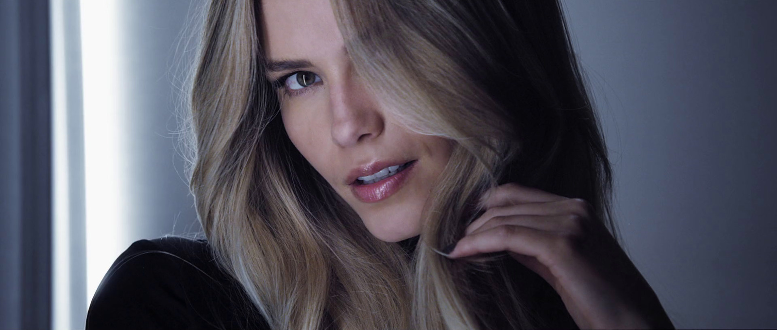 a close up of a woman with long hair