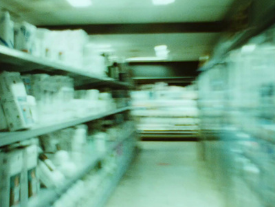 a blurry photo of a pharmacy aisle