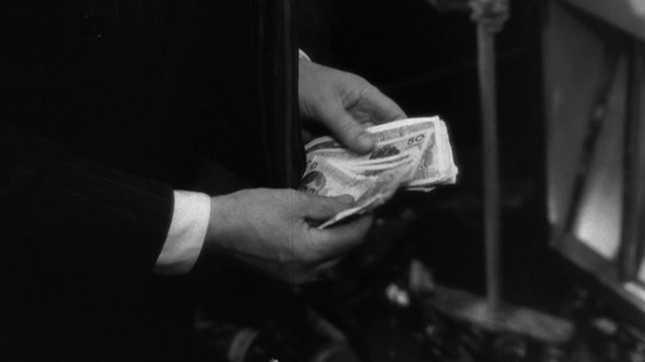 a person is holding money in their hand