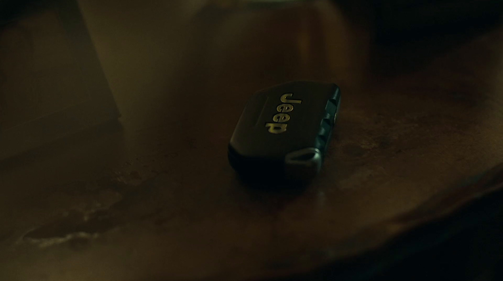 a cell phone sitting on top of a wooden table