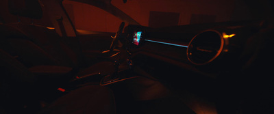 the interior of a car with the dash light on