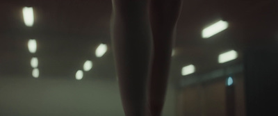 a blurry photo of a person's legs in the mirror