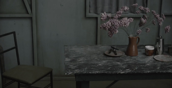 a table with a vase of flowers on it