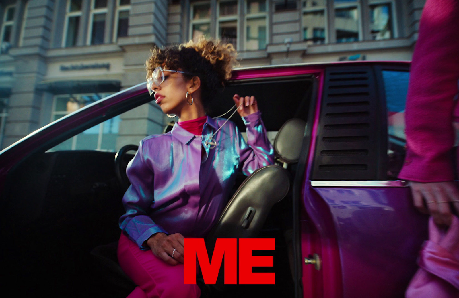 a woman sitting in the driver's seat of a car