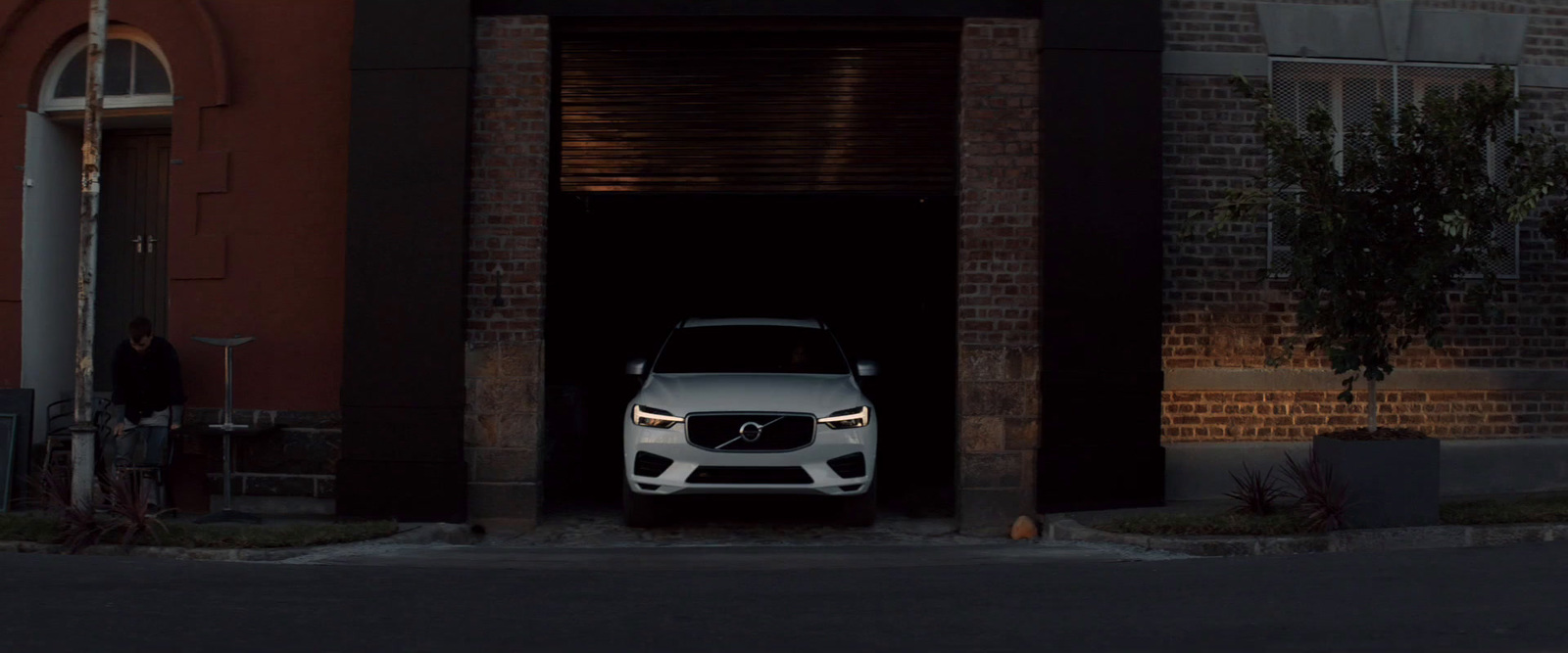 a white car is parked in a garage