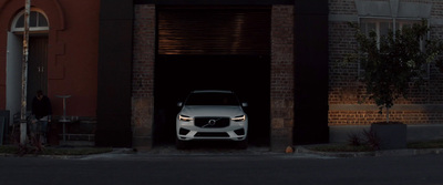 a white car is parked in a garage