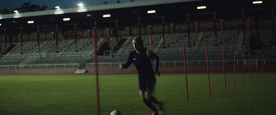 a soccer player on a field with a ball