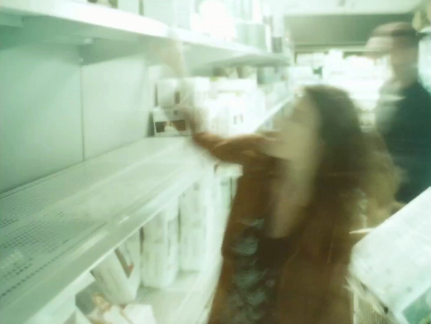 a blurry photo of a woman in a store