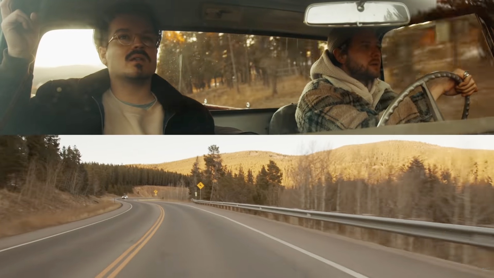 a man driving a car down a road next to another man driving a car