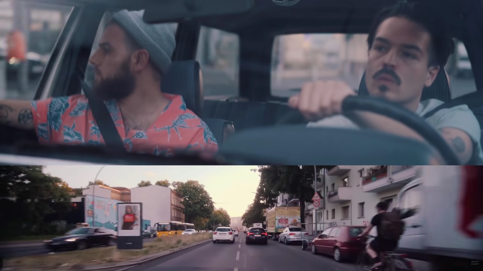 a man driving a car next to another man driving a motorcycle