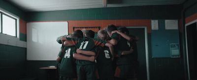 a group of people standing in a room together