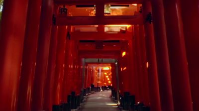 a long hallway lined with red columns and lights