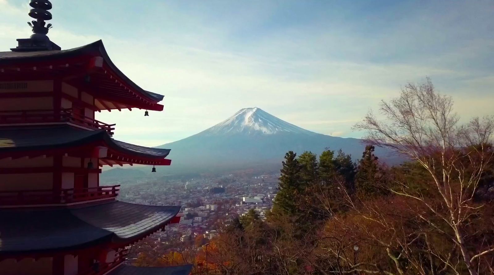 a view of a mountain with a pagoda in the foreground