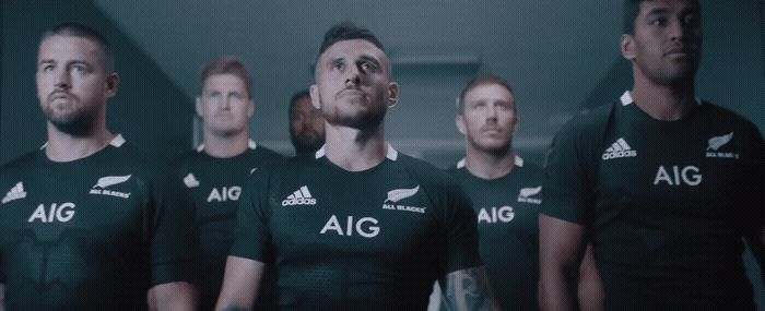 a group of rugby players standing next to each other