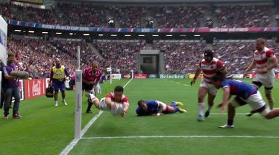 a group of men playing a game of rugby